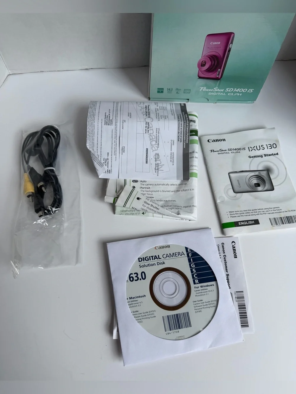Pink Canon PowerShot SD1400 IS 14.1 MP Digital ELPH Camera with 4x zoom bundle